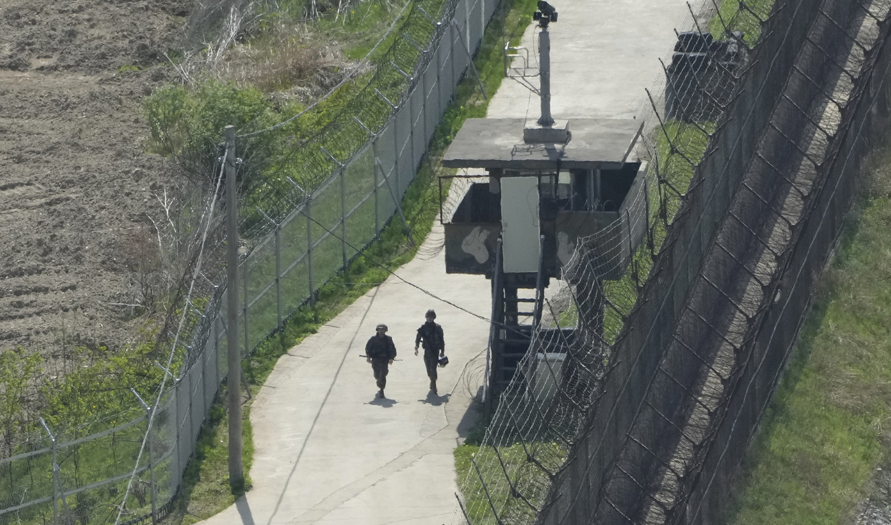 South Korean army soldiers patrol along the barbed-wire fence in Paju, South Korea, near the border with North Korea, on April 23, 2024. (AP/File)