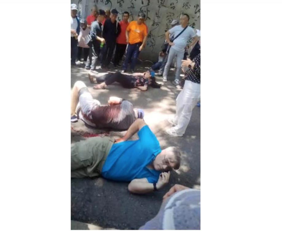 People gather around four American educators from an Iowa university, who were reportedly stabbed in a public park, according to the U.S. media and U.S. government officials, in Jilin City, Jilin province, China, in this still image taken from a video obtained by Reuters and released on June 10, 2024. (Reuters)