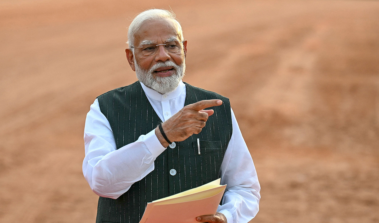 India’s Prime Minister Narendra Modi gestures before his speech as he holds a letter by President Droupadi Murmu (not pictured) requesting him to form the country’s new government, at the presidential palace Rashtrapati Bhavan in New Delhi on June 7, 2024. (AFP)