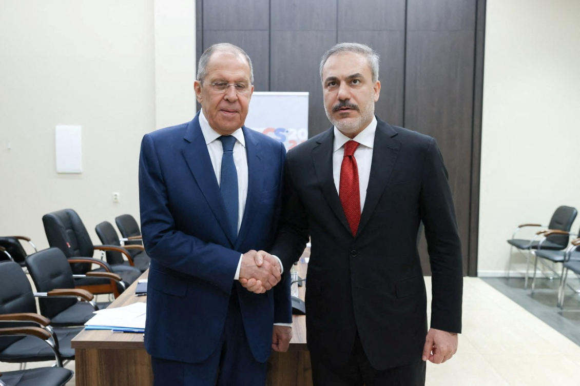 Russia’s Foreign Minister Sergei Lavrov shakes hands with Turkiye’s Foreign Minister Hakan Fidan during their meeting on the sidelines of a BRICS meeting in the city of Nizhny Novgorod, Russia(REUTERS)