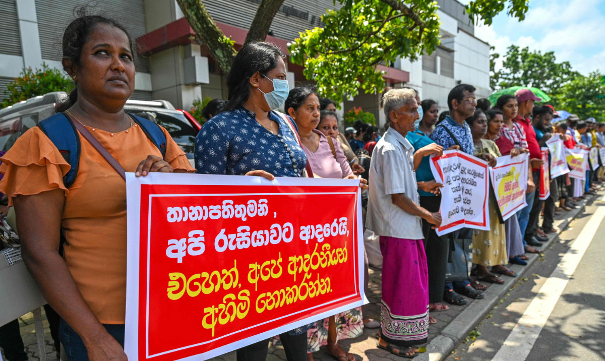 People protest near the Russian embassy in Colombo on June 4, 2024, seeking the release of Sri Lanka's ex-soldiers fighting for Russia and prisoners of war in Ukraine. (AFP)