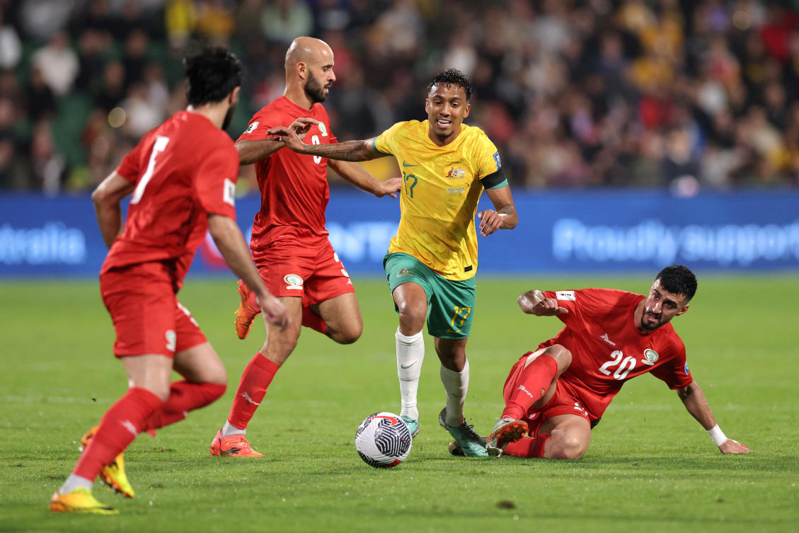 Keanu Baccus of Australia runs the ball during their Men’s World Cup Qualifier against Palestine at HBF Park in Perth, Jun. 11, 2024. (Reuters)