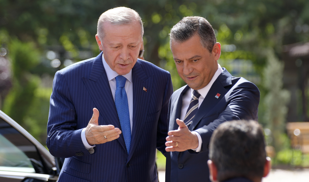 Recep Tayyip Erdogan, Turkiye’s President and leader of ruling Justice and Development Party, left, and Ozgur Ozel, the leader of main opposition Republican People’s Party, or CHP, gesture as Erdogan arrives for a meeting in Ankara, Turkey, Tuesday, June 11, 2024. (AP)