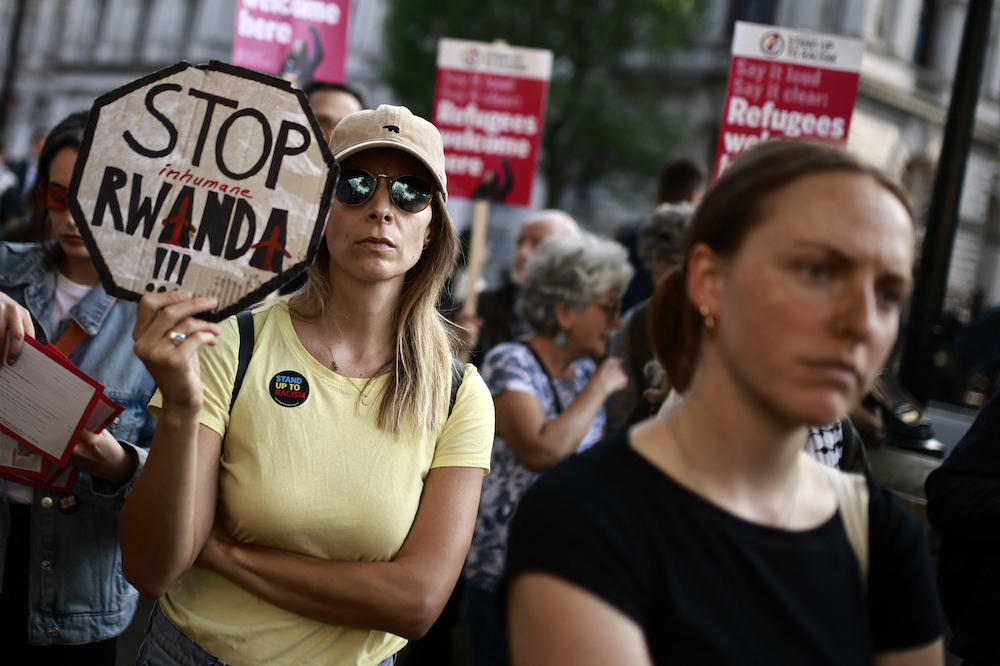 Demonstrators protest in front of 10 Downing Street in central London on May 8, 2024 to denounce the UK government’s Rwanda asylum plan. (AFP)