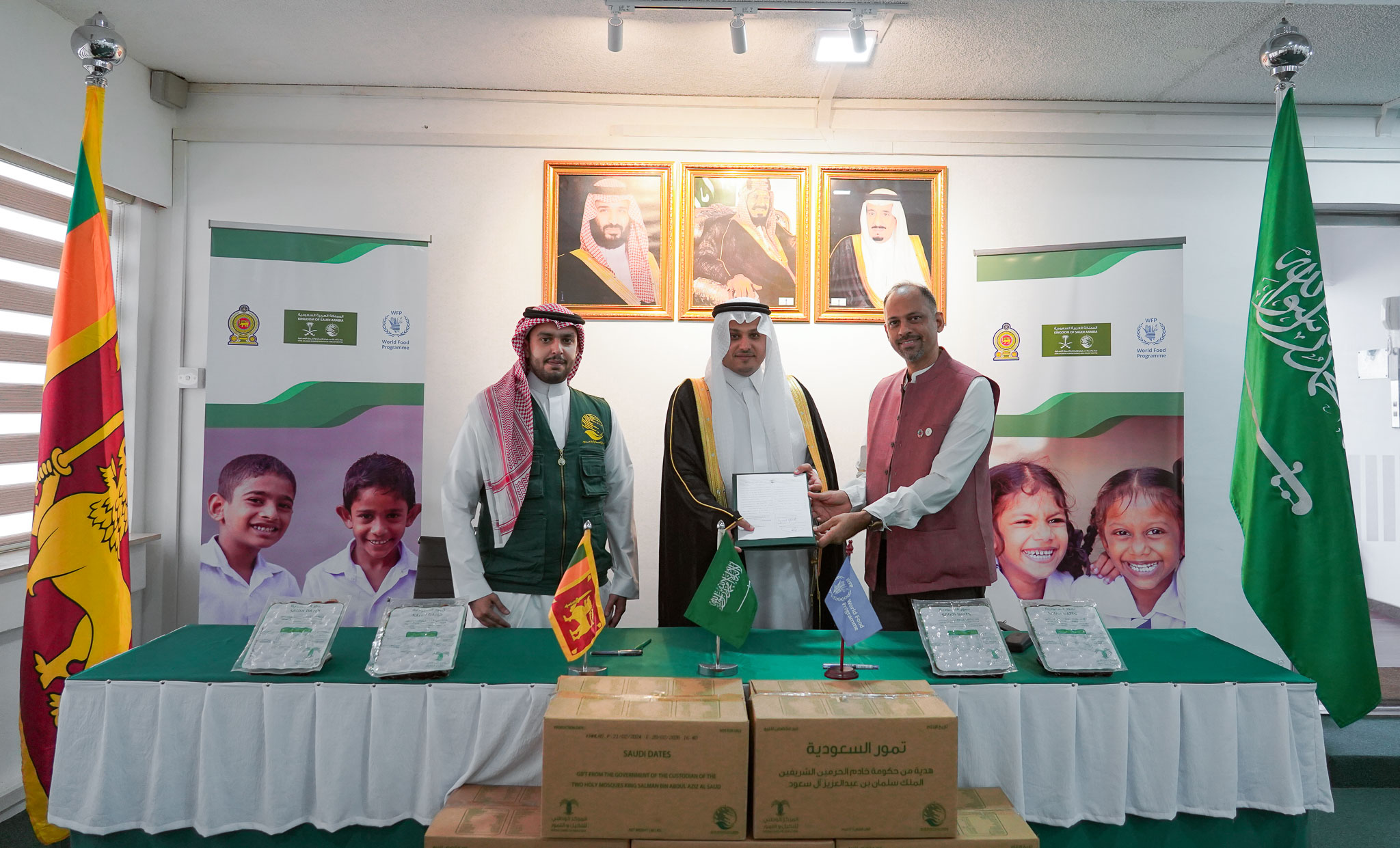 Khalid bin Hamoud Nasser Aldasam Alkahtani, ambassador of Saudi Arabia to Sri Lanka; Ibrahim Alkhalaf, supervisor of international relations and partnerships department at KSrelief; and Gerard Rebello, country director of the World Food Programme, Sri Lanka, sign the agreement acknowledging the donation of dates to be distributed in the national school meal programme. (Supplied)