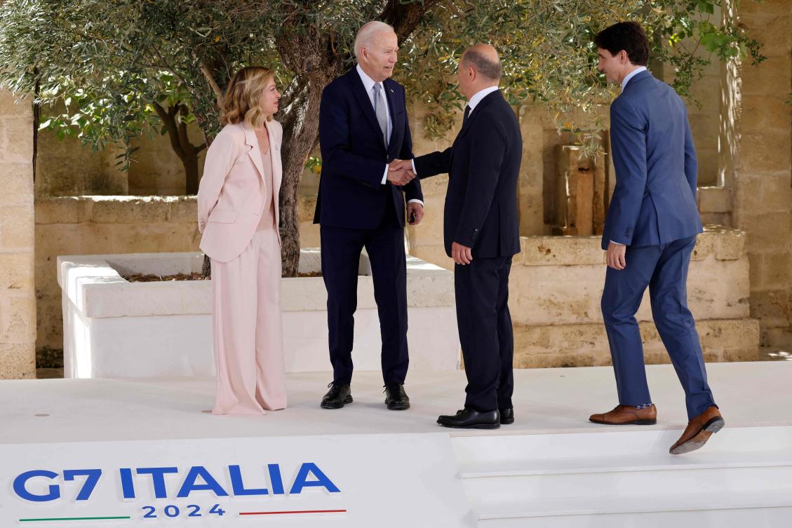 US President Joe Biden shakes hands with German Chancellor Olaf Scholz as Italy’s Prime Minister Giorgia Meloni and Canadian Prime Minister Justin Trudeau look on upon arrival at the Borgo Egnazia resort for the G7 Summit hosted by Italy on Jun. 13, 2024. (AFP)