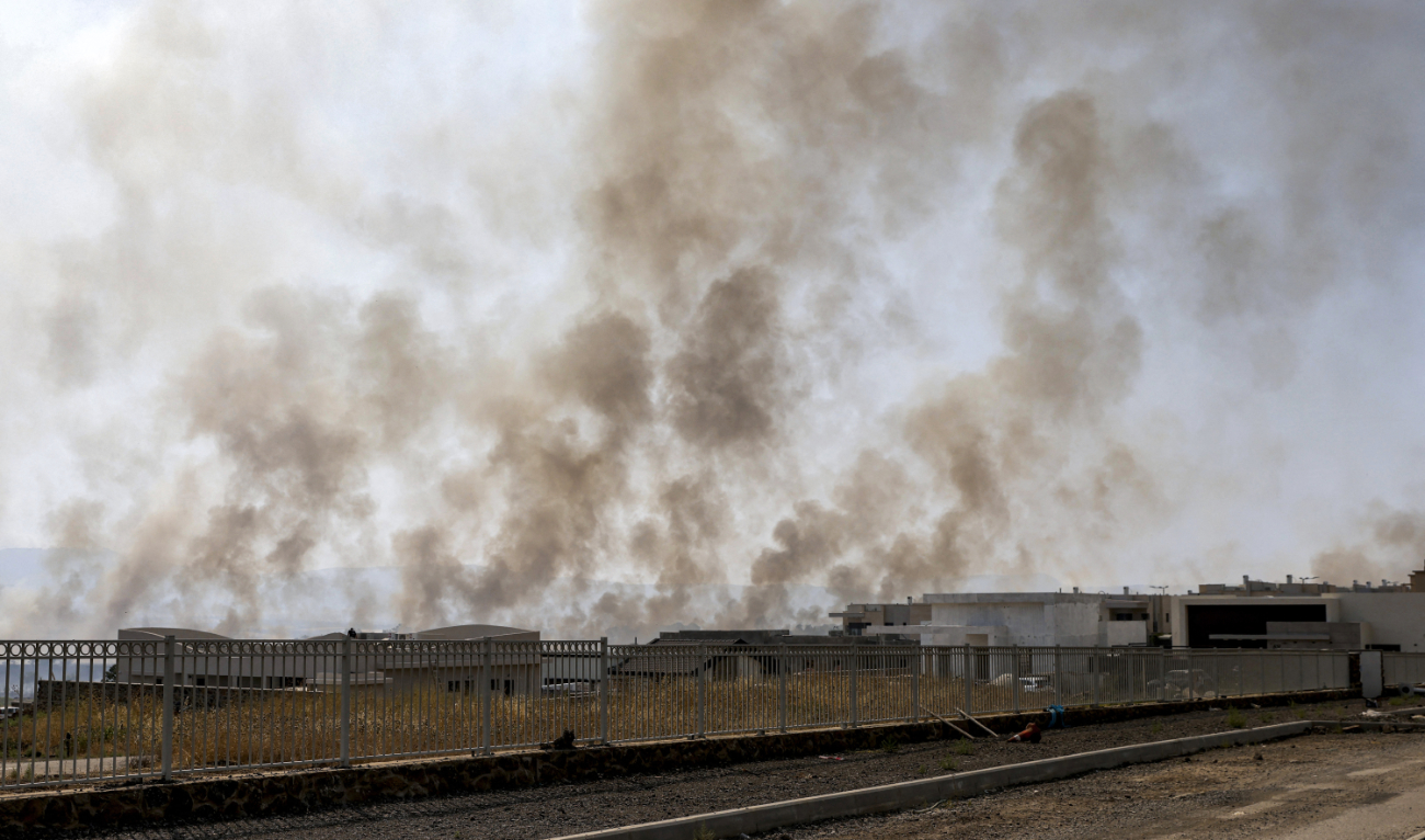 Smoke plumes rise from a fire in a field after rockets launched from southern Lebanon landed near Katzrin in the Israel-annexed Golan Heights on June 13, 2024. (AFP)