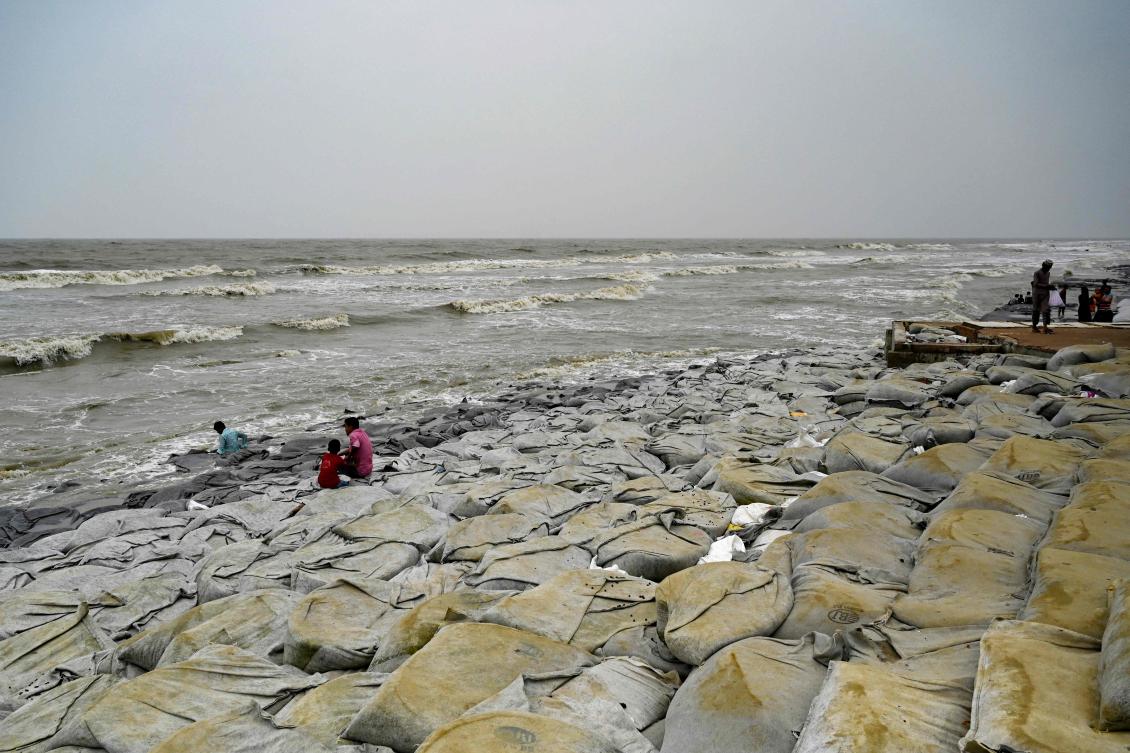 The three-part study calculated the low-lying South Asian nation was experiencing a sea level rise in places more than 60 percent higher than the global average. (AFP)