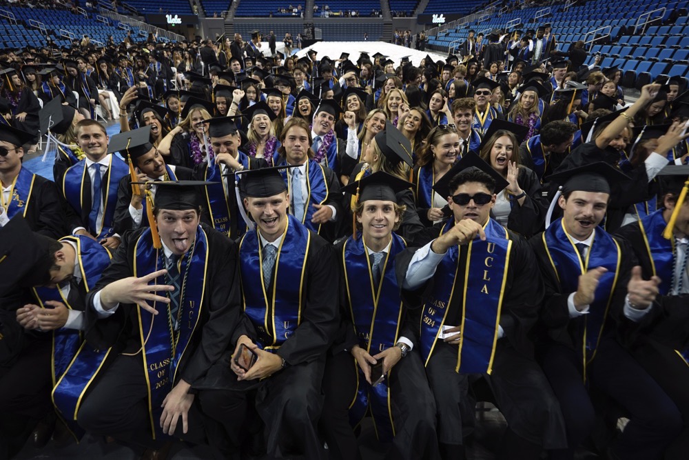 UCLA graduates from the class of 2024 pose for a photo prior to their commencement ceremony at Pauley Pavilion, Friday, June 14, 2024 in Los Angeles. (AP)
