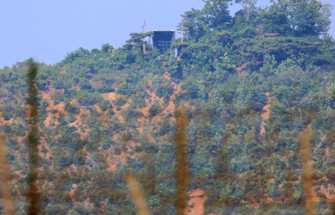 A facility, top center, believed to be North Korean loudspeakers are seen at the top of a hill in North Korea near the Demilitarized Zone dividing the two Koreas on June 11, 2024. (Yonhap/AFP)