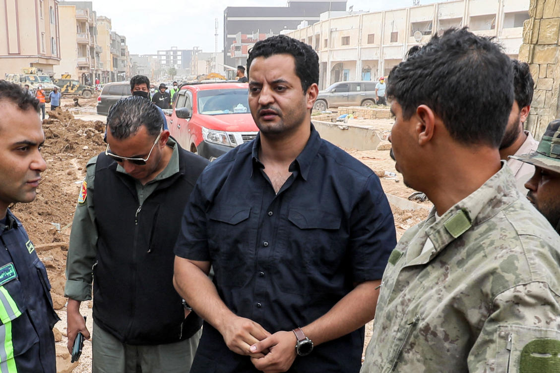 Khaled Haftar (C), son of Libya's eastern military strongman Khalifa Haftar, meets with emergency first responders in the devastated eastern city of Derna on September 18, 2023 following deadly flash floods. (AFP)