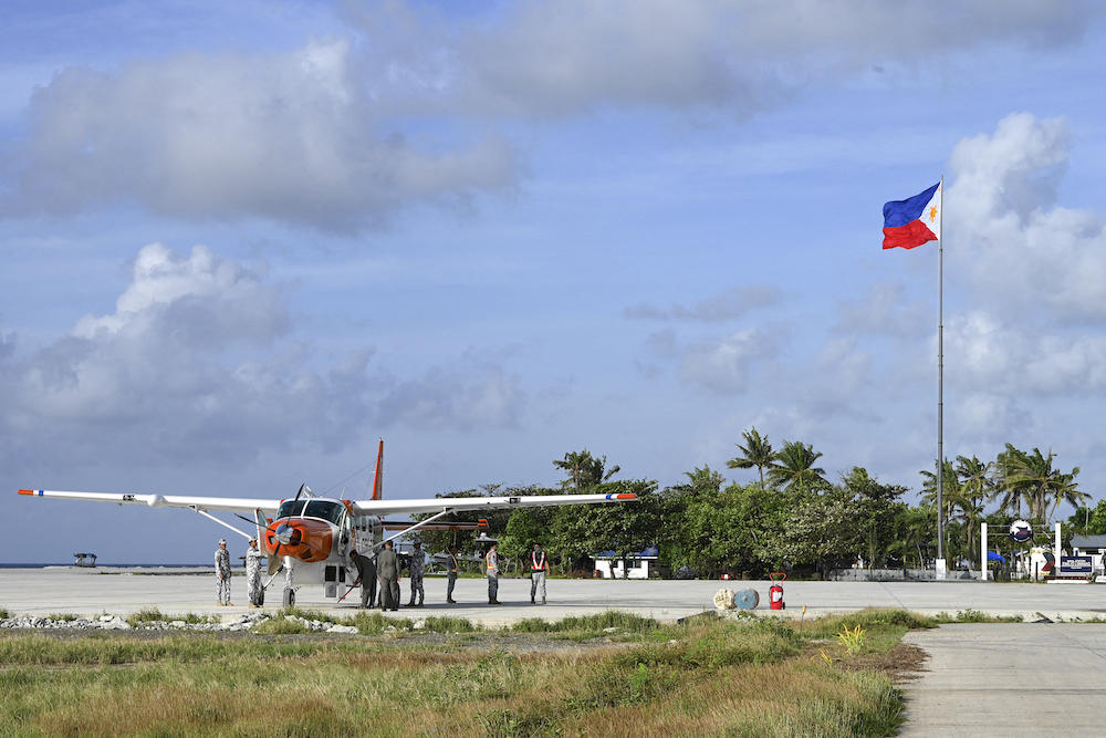 Above, a Philippine Coast Guard is seen parked on Thitu Island in the disputed South China Sea on Dec. 1, 2023. Hostilities and tensions in the disputed waters have alarmingly escalated particularly between China and the Philippines over two disputed shoals since last year. (AFP)