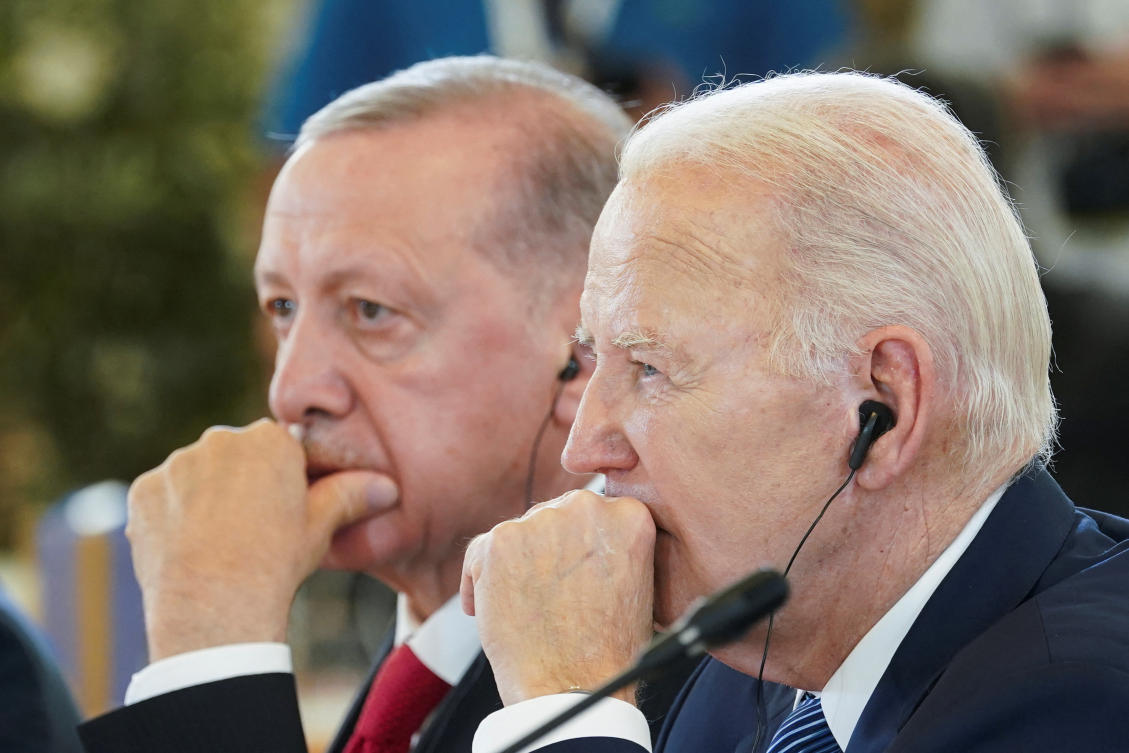 US President Joe Biden, right, and Turkiye’s President Recep Tayyip Erdogan attend the second day of the G7 summit in Borgo Egnazia, Italy on June 14, 2024. (Reuters)