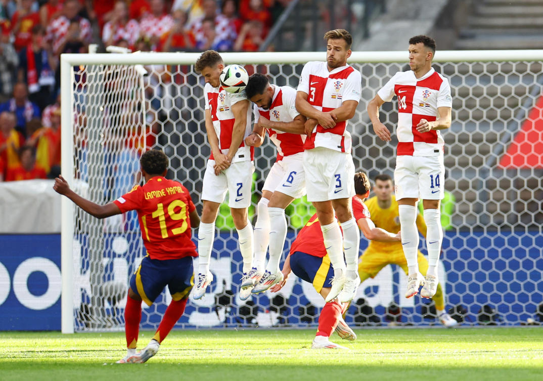 Spain’s Lamine Yamal shoots at goal from a free kick as Croatia’s Josip Stanisic and Josip Sutalo block the shot in a defensive wall during their Euro 2024 — Group B — match at Berlin Olympiastadion, Berlin, on Jun. 15, 2024. (Reuters)