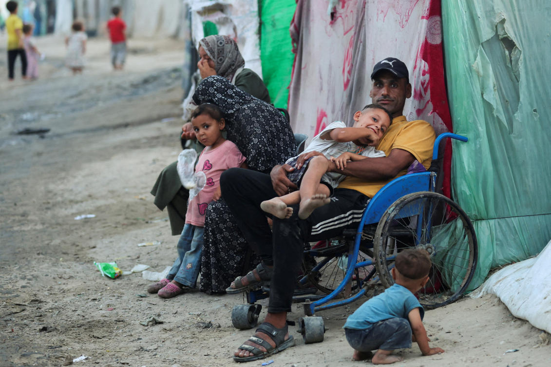 The pause is aimed at allowing aid trucks to reach the Israel-controlled Kerem Shalom crossing. (Reuters)