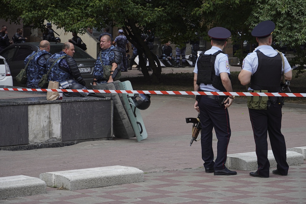 Russian policemen and Rosguardia servicemen gather not far from a pretrial detention center in Rostov on June 16, 2024. (AP)