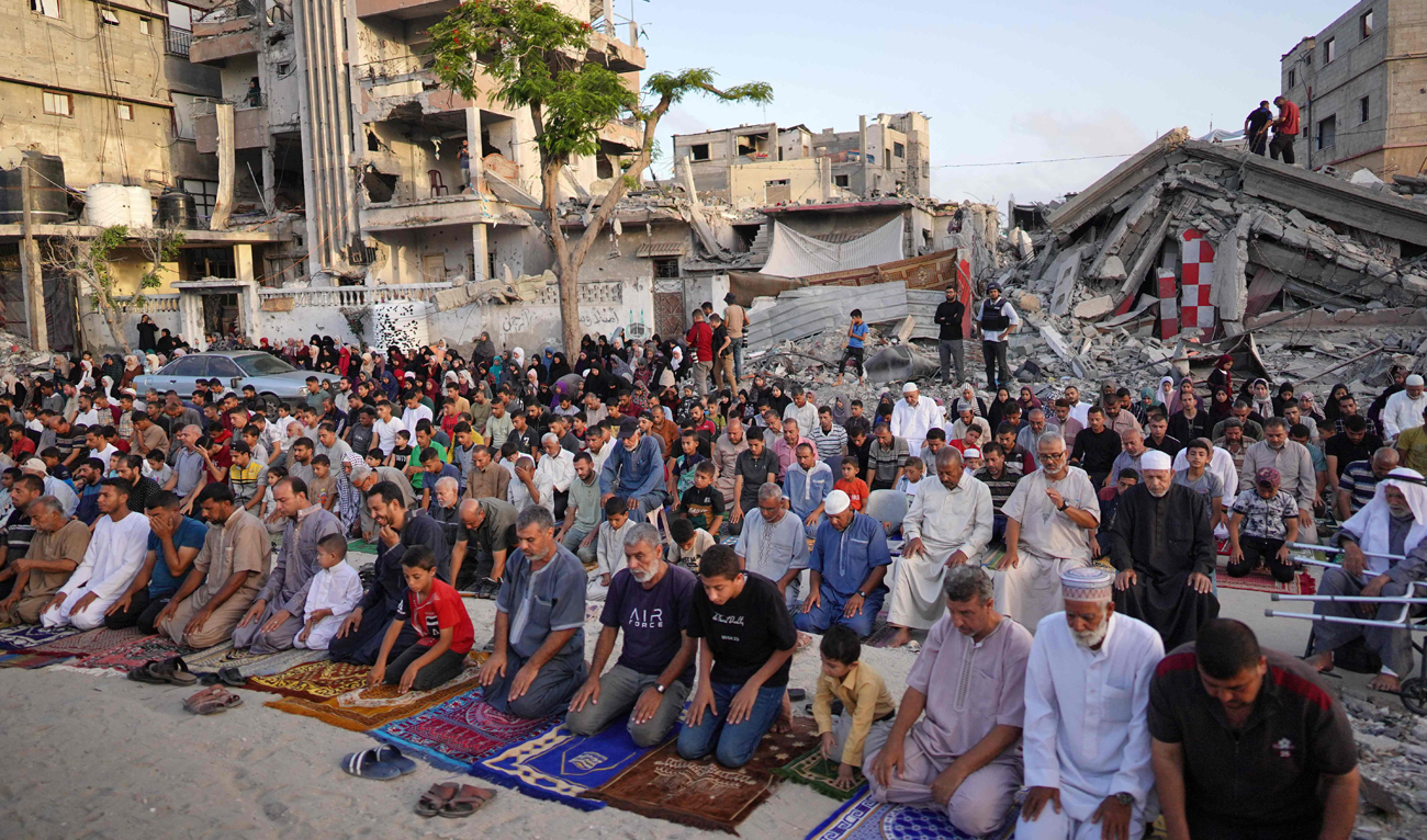 Palestinians perform the Eid Al-Adha morning prayer in Khan Yunis in the southern Gaza Strip, on the first day of the Muslim holiday marking the end of the Hajj pilgrimage to Makkah, on June 16, 2024. (AFP)
