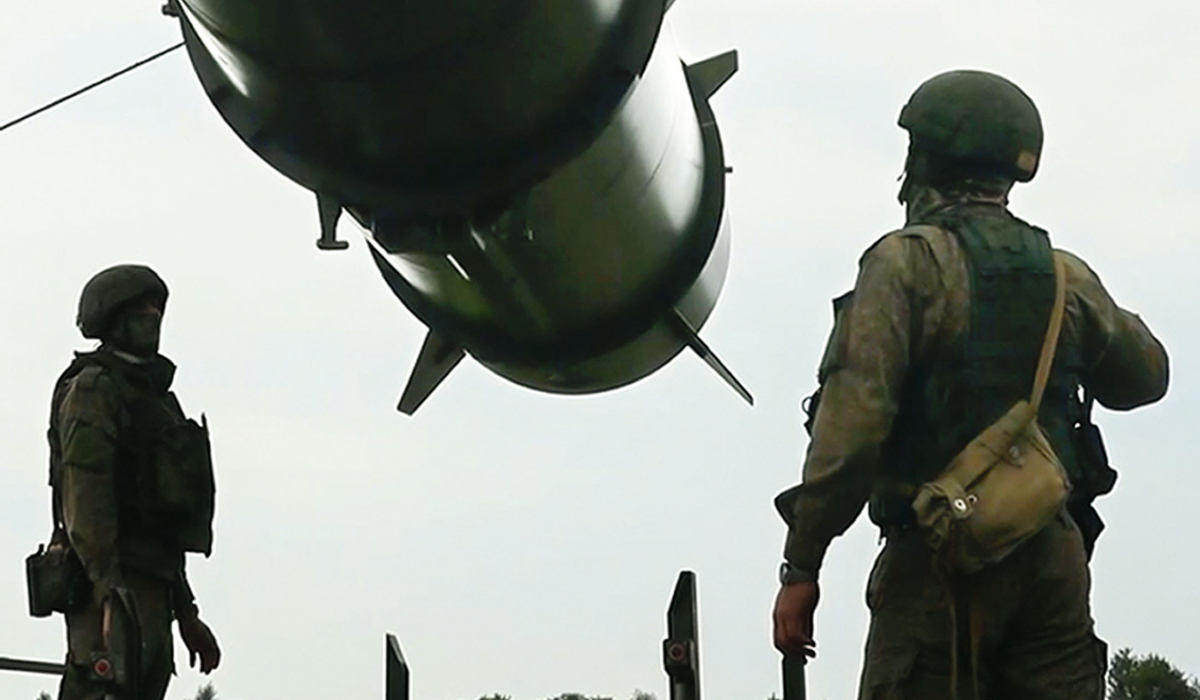 In this photo taken form video released by the Russian Defense Ministry Press Service on Wednesday, June 12, 2024, Russian soldiers load a Iskander-M short-range ballistic missile launchers at a firing position as part of Russian military drill intended to train the troops in using tactical nuclear weapons. (Russian Defense Ministry Press Service via AP)