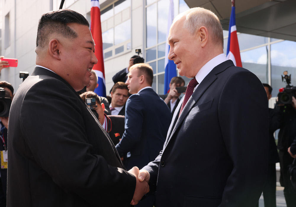 Russia’s President Vladimir Putin, right, welcomes North Korea’s Kim Jong Un at the Vostochny Cosmodrome in Amur region on Sept. 13, 2023. (AFP)