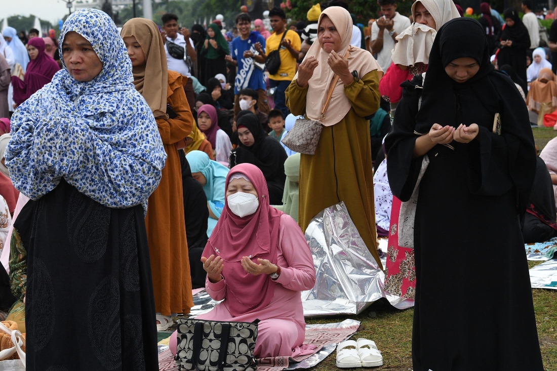 Muslims take part in Eid Al-Adha prayers at a park in Manila on June 16, 2024. (AFP)