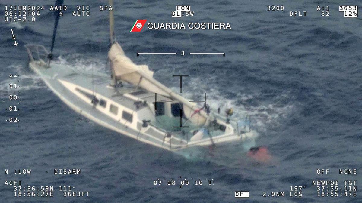 This photo taken and handout on June 17, 2024 by the Guarda Costiera, the Italian Coast Guards, shows a sailboat off the coast of Calabria. According to Coast Guards 12 people from the sailboat adrift near the dividing line between Italian and Greek waters have been rescued. (AFP/Guardia Costiera/Handout)