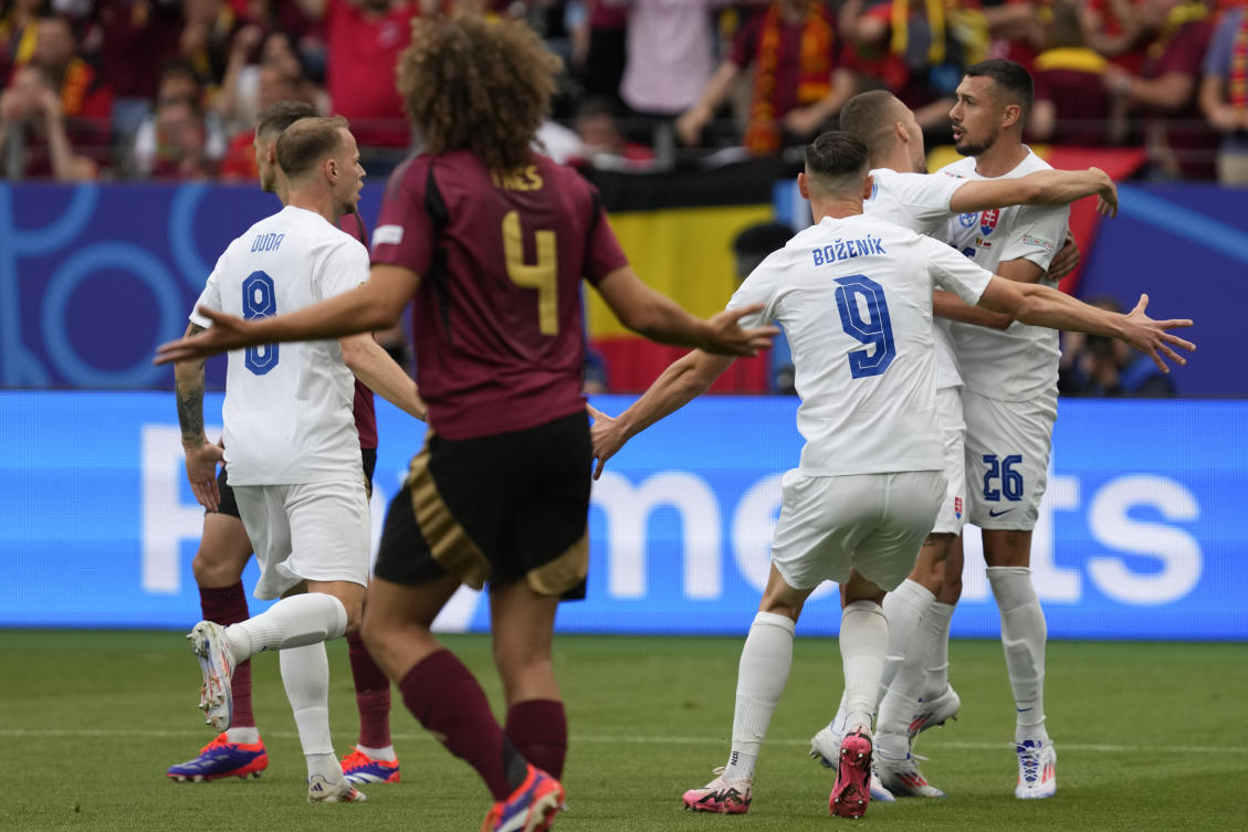 Slovakia’s Ivan Schranz, right, is congratulated by teammates after scoring against Belgium at Euro 2024 in Frankfurt, Germany, Monday, June 17, 2024. (AP Photo)