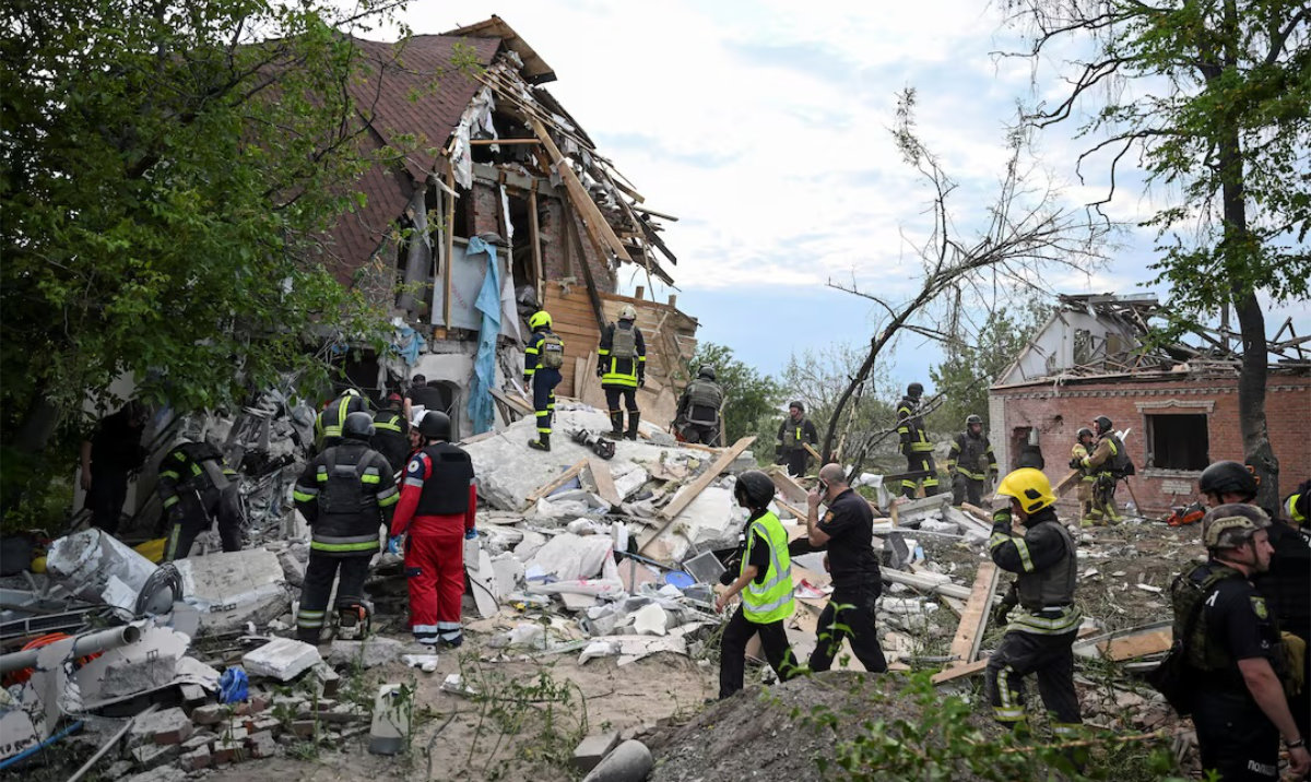 Rescuers work at a site of a private house destroyed during a Russian air strike, amid Russia's attack on Ukraine, in Kharkiv, Ukraine June 10, 2024. (Reuters)