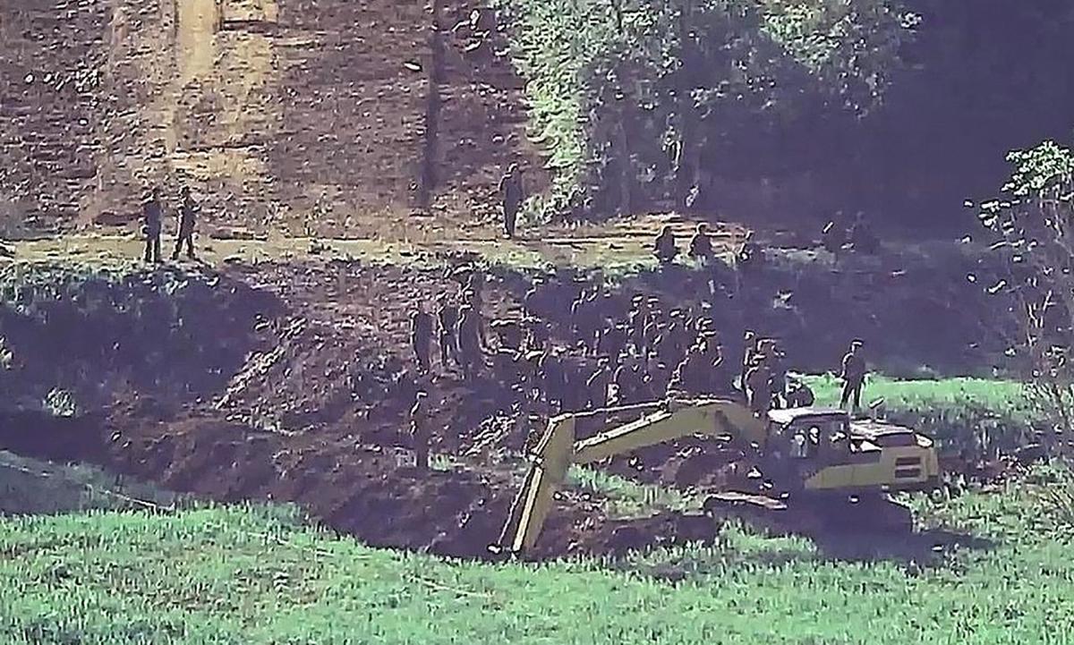 Above North Korean soldiers work at an undisclosed location near the heavily fortified border, as seen from a South Korean guard area, in this undated photo released on June 18, 2024. (South Korean Defense Ministry/AFP)