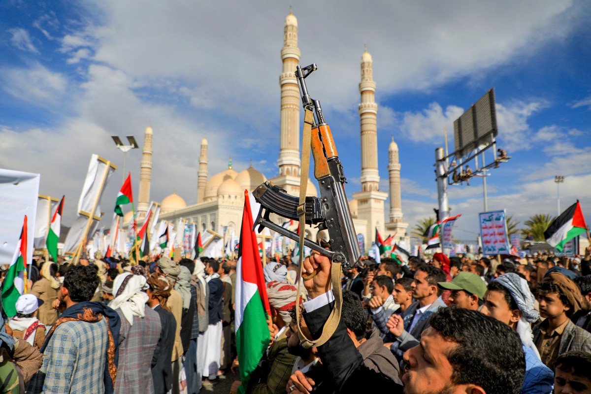 Yemenis brandish weapons and chant slogans as they march in the Huthi-run capital Sanaa on March 8, 2024, in support of Palestinians. (File/AFP)