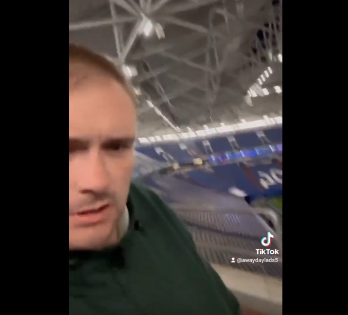A screengrab taken from a video that went viral showing an England fan waking up cold and confused in an empty stadium hours after the end of his team's Euro 2024 clash with Serbia. (X/@FBAwayDays)