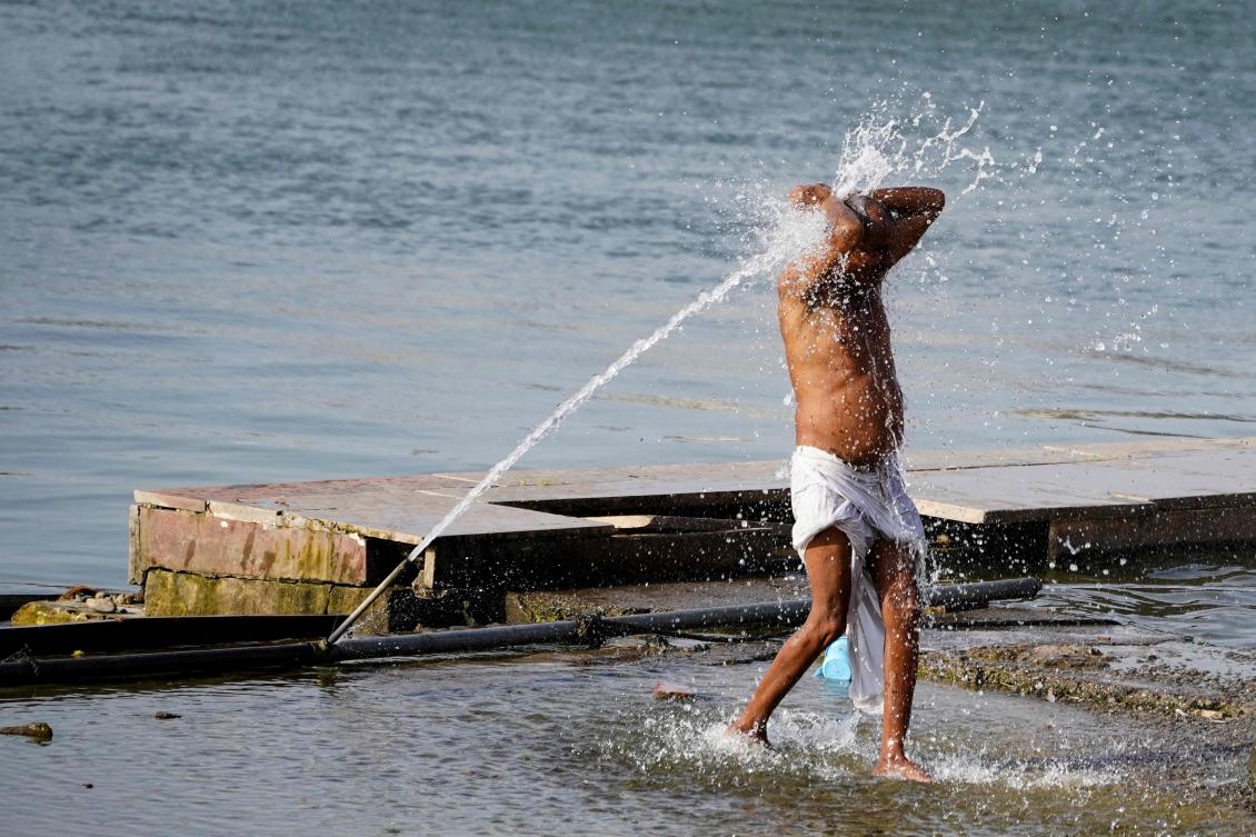 Searing heatwave temperatures in northern India pushed power demand to a record high, the government said on June 18, with residents of the capital New Delhi also struggling with water shortages. (AFP)