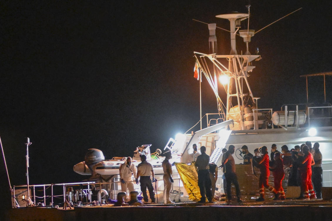 The bodies of some of the 64 migrants missing in the Mediterranean Sea after their ship wrecked off Italy’s southern coast are disembarked at the Italian southern port-city of Roccella Ionica, on Jun. 19, 2024. (AP)