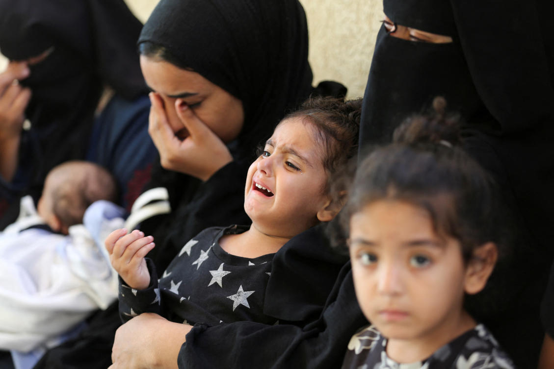 Mourners react next to the bodies of Palestinians, killed in Israeli strikes due to a military operation in Rafah, amid the Israel-Hamas conflict, during their funeral in Khan Younis, in the southern Gaza Strip, June 18, 2024. (Reuters)