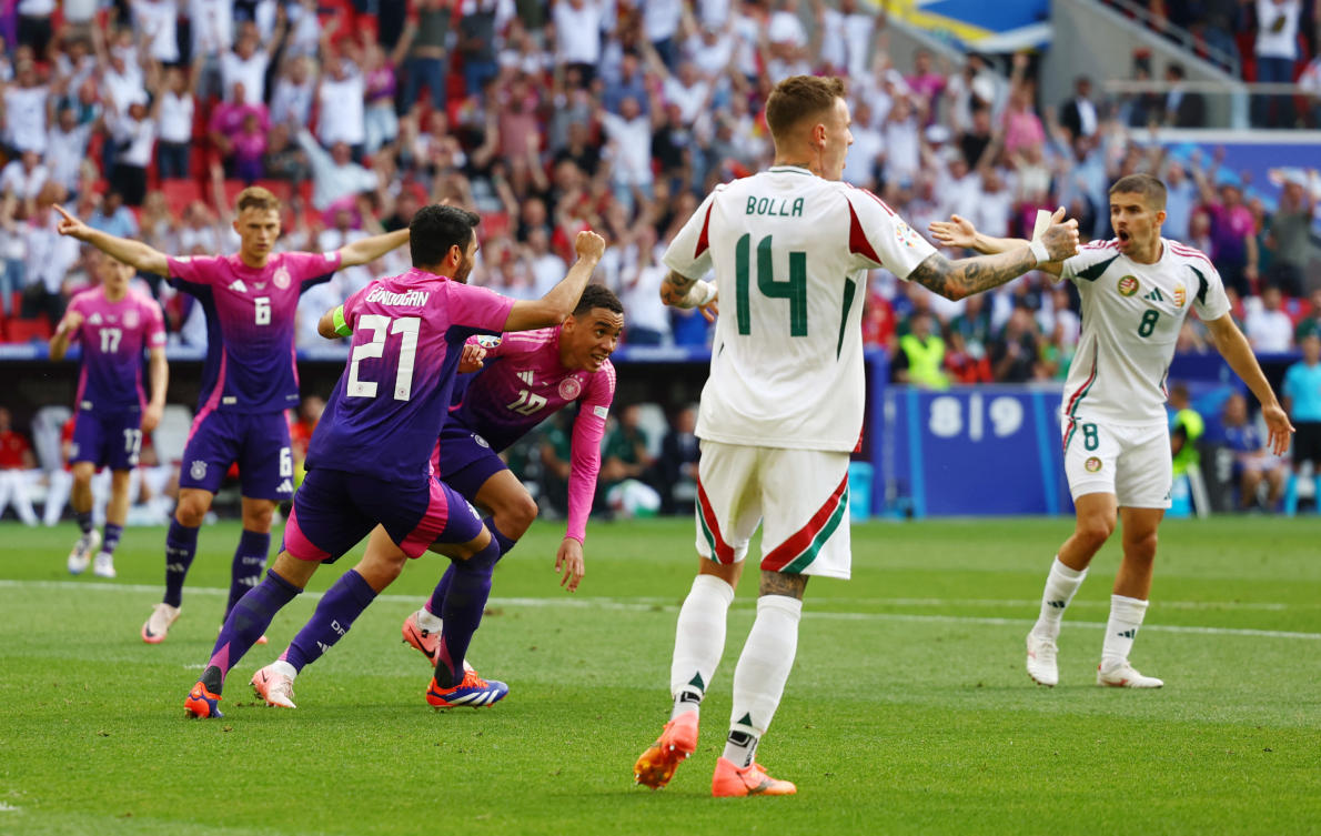 Germany’s Jamal Musiala celebrates scoring their first goal with Ilkay Gundogan as Hungary’s Bendeguz Bolla and Adam Nagy react during their Euro 2024 — Group A — match at Stuttgart Arena, Stuttgart, on Jun. 19, 2024. (Reuters)