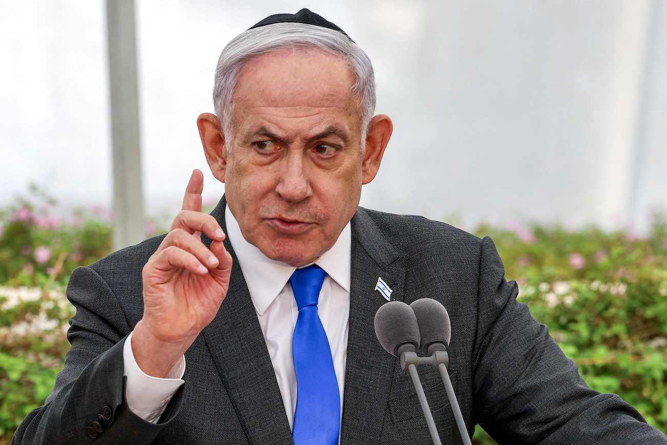 Israeli Prime Minister Benjamin Netanyahu speaks during a state memorial ceremony at Nachalat Yitzhak cemetery in Tel Aviv on June 18, 2024. (AFP)