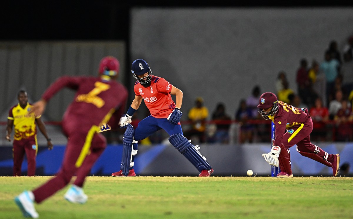 West Indies' wicketkeeper Nicholas Pooran (R) dives to save a run during the ICC men's Twenty20 World Cup 2024 Super Eight cricket match between England and the West Indies at Daren Sammy National Cricket Stadium in Gros Islet, Saint Lucia, on June 19, 2024 (AFP)