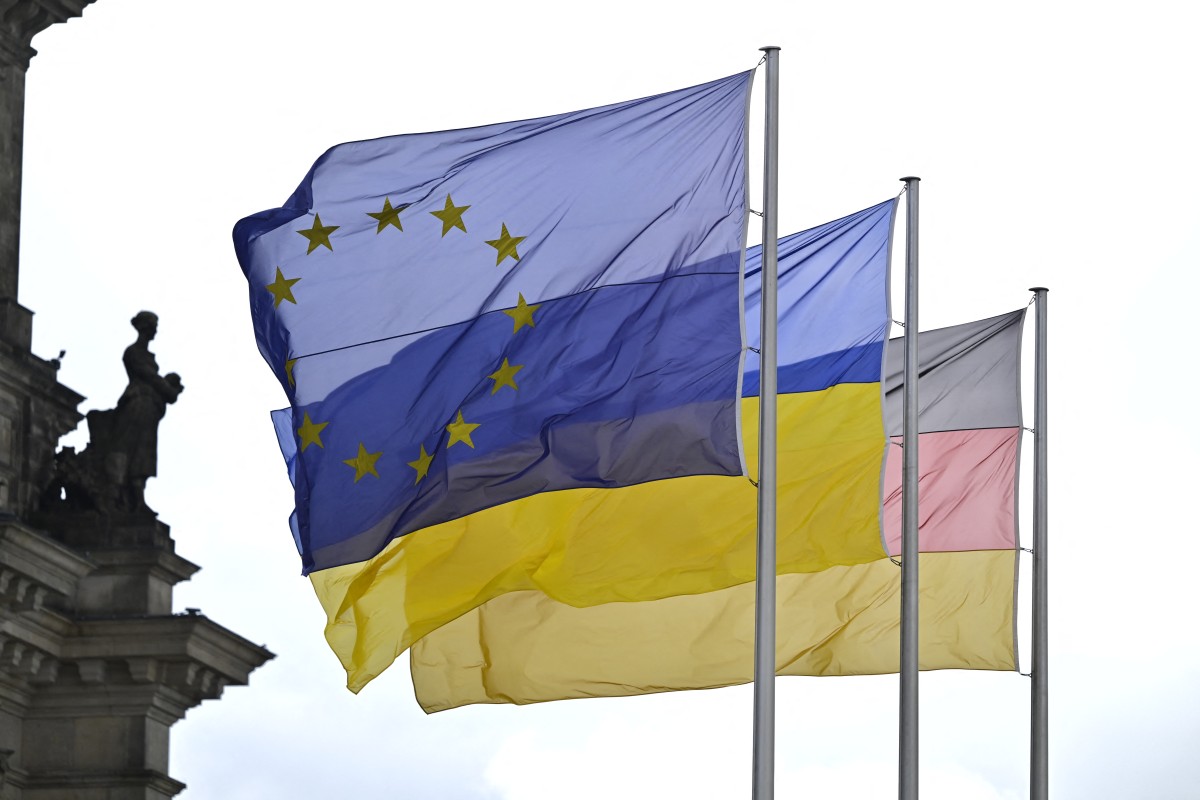 The EU, Ukrainian and German flags flutter in front of the Reichstag building housing the Bundestag (lower house of parliament) in Berlin on June 11, 2024, ahead of President of Ukraine's speech on the sidelines of the Ukraine Recovery Conference.(AFP)