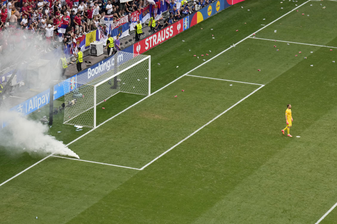 Slovenia’s goalkeeper Jan Oblak stands in front of the goal after Serbia’s Luka Jovic scored his side’s first goal during their Group C match at the Euro 2024 tournament in Munich on Jun. 20, 2024. (AP)