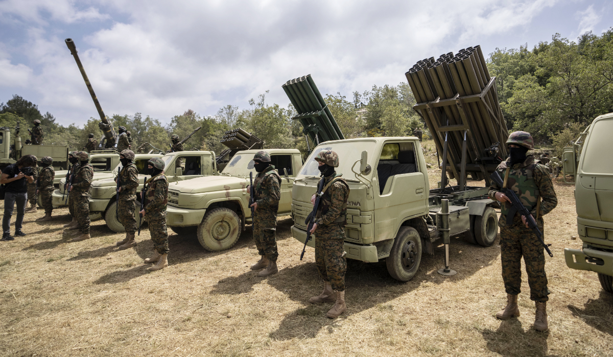 Fighters from the Lebanese militant group Hezbollah carry out a training exercise in Aaramta village in the Jezzine District, southern Lebanon, Sunday, May 21, 2023. (AP)