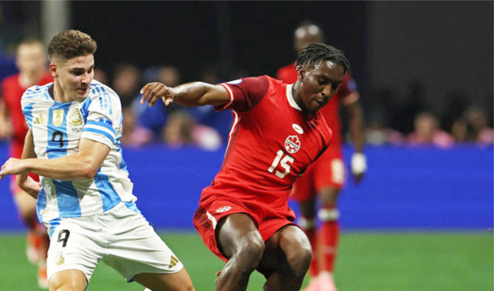 Argentina's Julian Alvarez, left, in action with Canada's Moise Bombito. (Reuters)