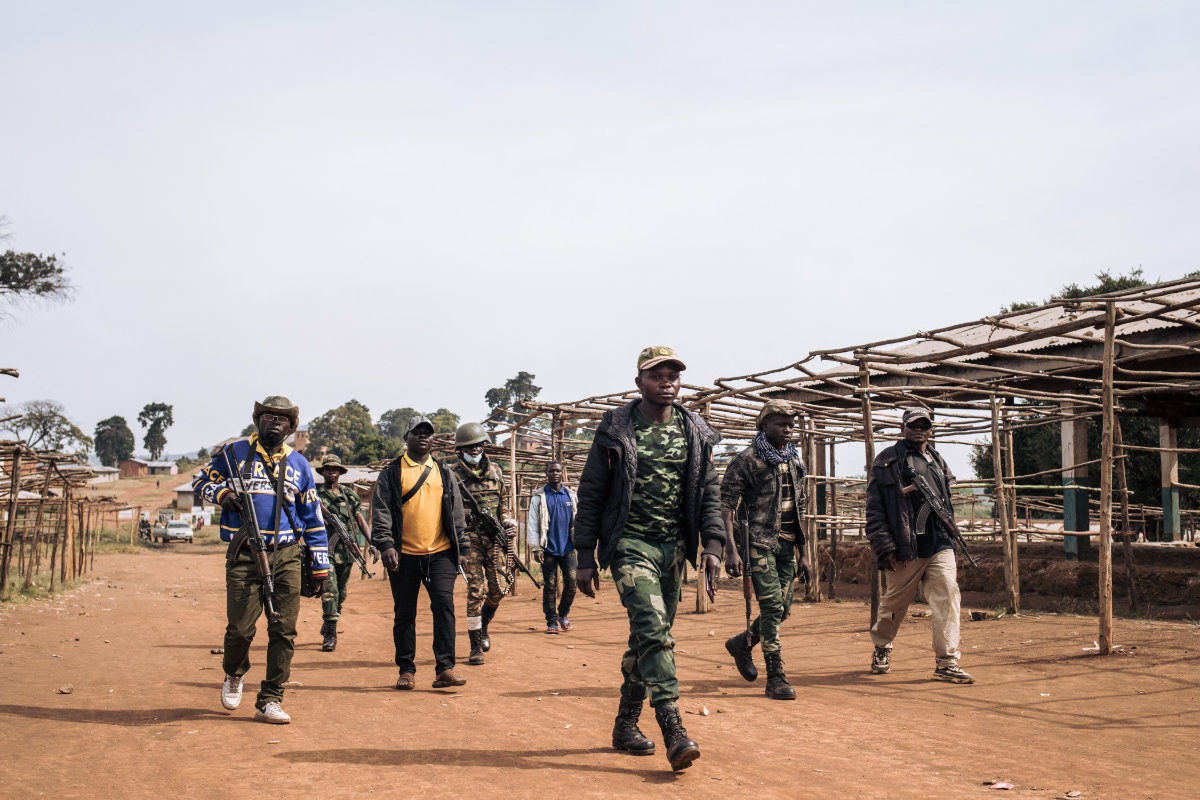 Commanders of the URDPC/CODECO militia walk through the village of Linga on January 13, 2022, in Ituri province, northeastern Democratic Republic of Congo. (AFP/File)