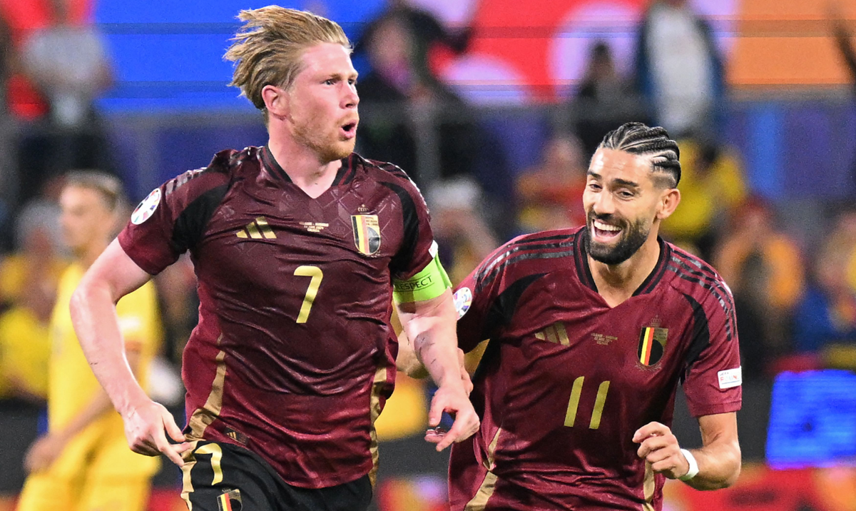 Belgium's midfielder Kevin De Bruyne (L) celebrates scoring his team's second goal with his teammate Belgium's forward Yannick Carrasco during the UEFA Euro 2024 Group E football match between Belgium and Romania at the Cologne Stadium in Cologne on June 22, 2024. (AFP)