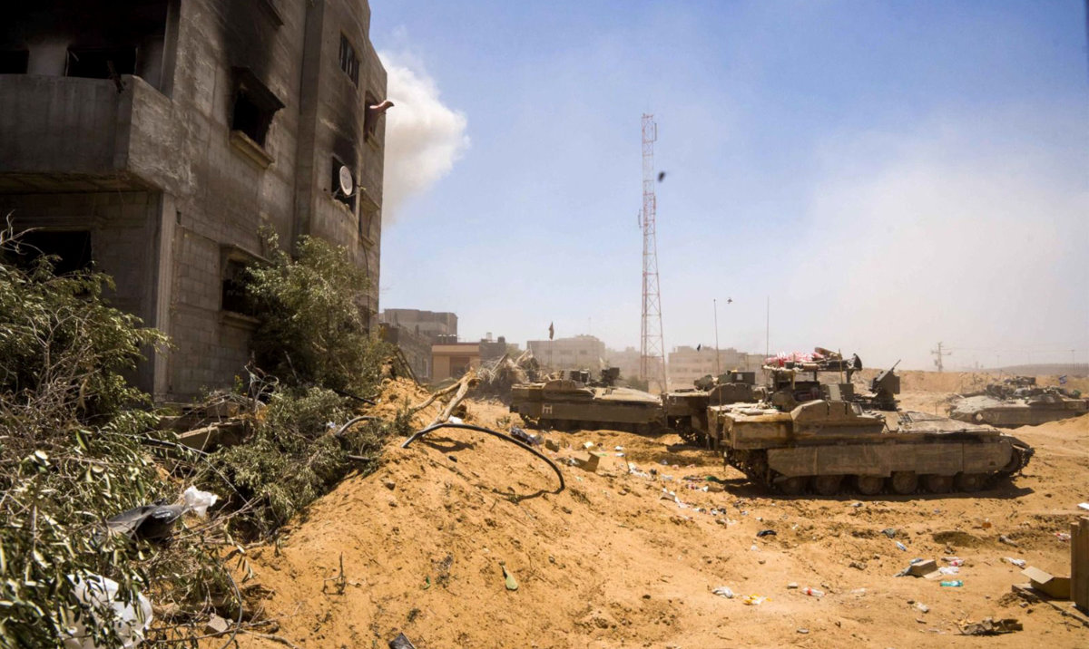 This handout picture released by the Israeli army on June 23, 2024 reportedly shows Israeli army armored vehicles operating in Rafah in the southern the Gaza Strip amid the ongoing conflict in the Palestinian territory between Israel and Hamas. (AFP)