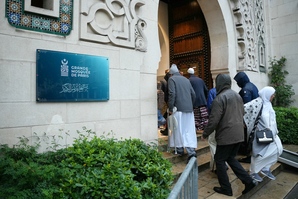 Above, Muslim worshipers arrive at the Great Mosque of Paris to perform morning Eid Al-Adha prayers on June 16, 2024. France has the largest Muslim population in Europe, with up to 10 percent of the country’s 67 million people belonging to the faith. (AFP)