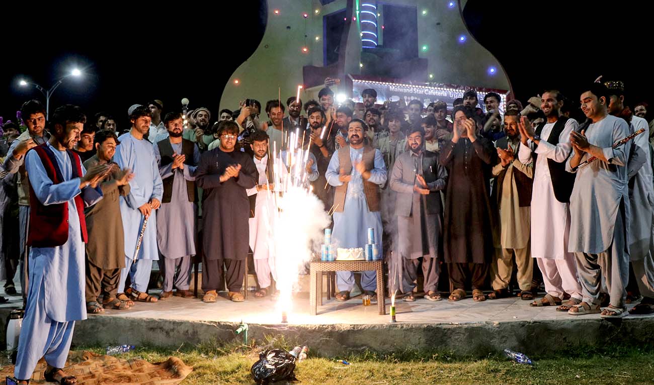 Afghan fans burst firecrackers in Khost on June 23, 2024 to celebrate Afghanistan's win against Australia at their ICC men's Twenty20 World Cup 2024 Super Eight cricket match. (AFP)