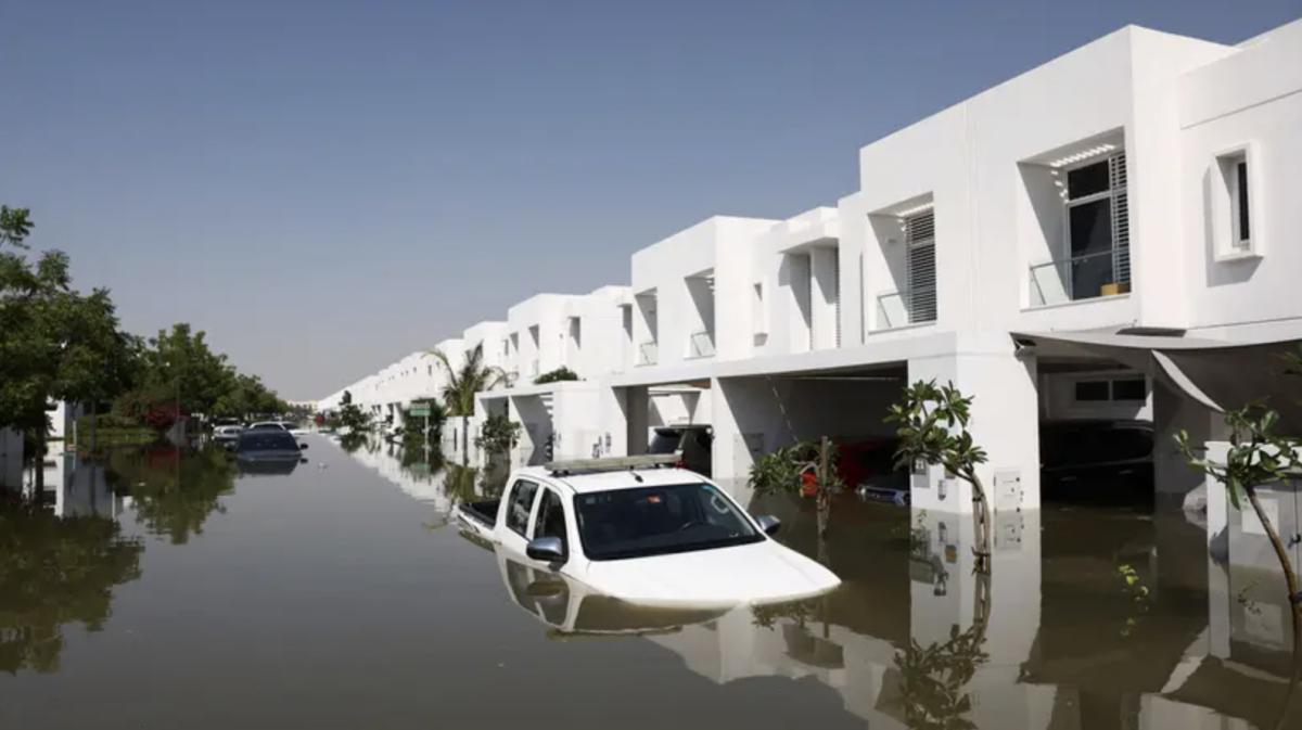 Cars lie partially submerged in water at a residential complex following heavy rainfall, in Dubai, United Arab Emirates, April 18. (Reuters)