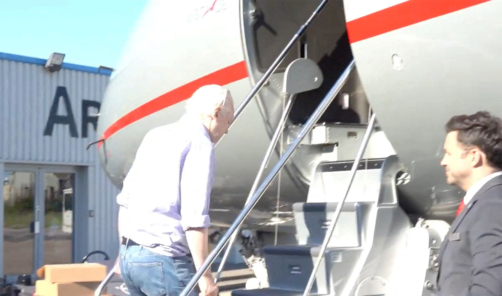 WikiLeaks founder Julian Assange boards a plane at a location given as London, Britain, in this still image from video released on June 25, 2024. (@wikileaks via X/Handout via REUTERS)