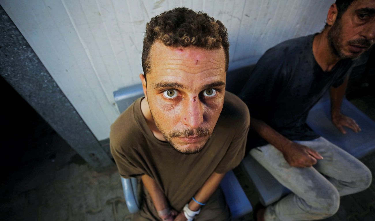 Badr Dahlan, who was released on June 20 by the Israeli army, appeared to be in a state of shock as he answered questions at Shuhada Al-Aqsa Hospital in Deir Al-Balah. (Getty Images)
