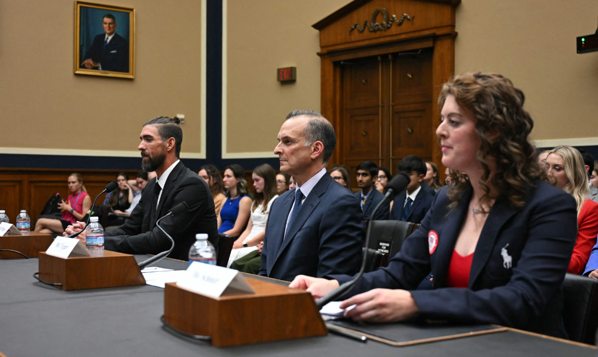 Former US Olympians Michael Phelps (L) and Allison Schmitt (R) and US Anti-Doping Agency CEO Travis Tygart during a House Oversight and Investigations Subcommittee hearing on anti-doping measures ahead of the 2024 Paris Olympics on Capitol Hill in Washington, DC, June 25, 2024. (AFP)
