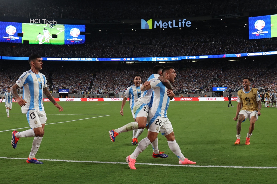 Lautaro Martinez of Argentina celebrates after scoring the team's first goal during the CONMEBOL Copa America 2024 match between Chile and Argentina at MetLife Stadium on Tuesday in East Rutherford, New Jersey. (GETTY IMAGES NORTH AMERICA /AFP)